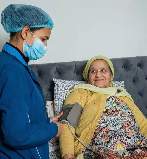 Smiling doctor and patient during home healthcare visit